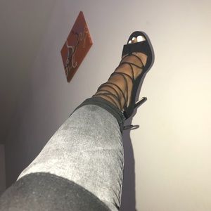 Black heel with tie up laces and zipper in back